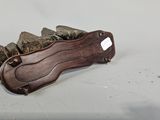 a knife that is laying on top of a pile of rocks