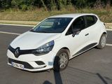 a white car that is parked on the side of the road
