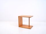 a small wooden table with a small shelf on top of it