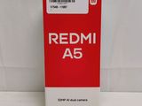 the redmi a5 box is open on a white surface