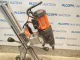 an image of a drill on a stand in front of a wall