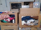 two boxes with clothes in them on a carton