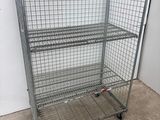 wire mesh shelf with four shelves on wheels in a room
