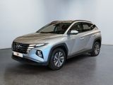 a silver toyota rav parked in a room with a white wall