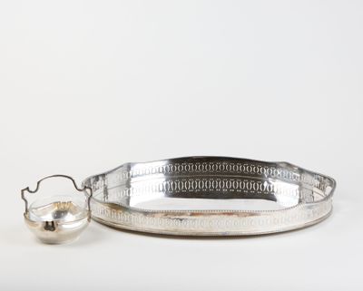 a silver tray with a handle and a teapot on it