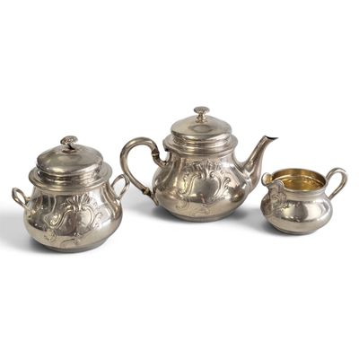 three pieces of silver tea set on a white background