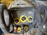 a machine that is sitting on the floor in the garage