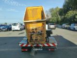 a dump truck that is parked in a parking lot