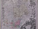 an old map of the country of england in a wooden frame