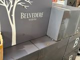 boxes stacked on top of each other with a bottle of wine on top of them