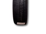 a close up of a tire on a white surface