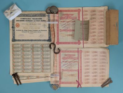 a book with a bunch of papers and keys on top of it
