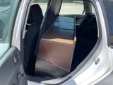 a car door open with a box in the back of it