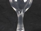a wine glass that is sitting on a black table