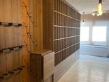 a room with a lot of bookshelves and shelves in it