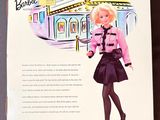 a barbie doll that is in the box on the table