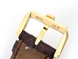 brown leather watch strap with gold buckle on a white background