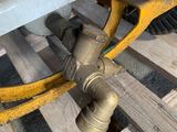 a close up of a pipe on a wooden pallet