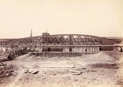 a black and white photo of a bridge that is under construction