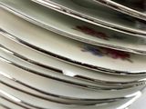 many plates stacked on top of each other on a table