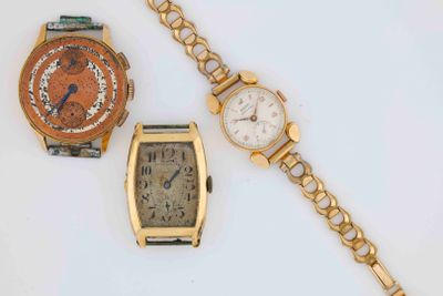 two watches and a bracelet are sitting next to each other
