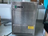 an image of a stainless steel refrigerator in a room