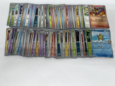 a lot of pokemon cards on the table
