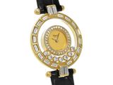 a close up of a gold watch with diamonds on the face