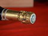 a close up of a bottle of wine on a table