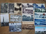 a lot of old photographs on the table