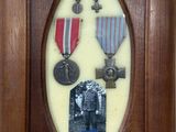 a picture of a picture of a man and a woman with medals
