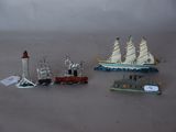 three small toy ships on a table next to each other