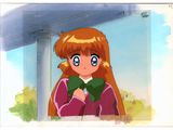 cartoon girl with red hair and blue eyes holding a green book