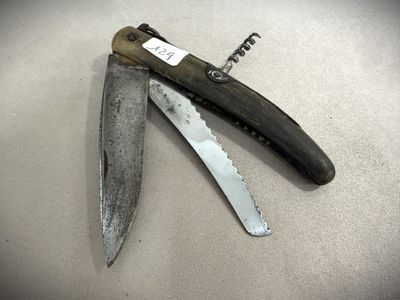 a knife that is laying on top of a table