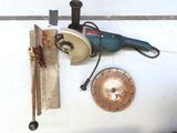 a picture of a drill and some tools on a table