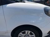a white car that is parked in a parking lot