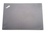 a laptop that is sitting on a white surface