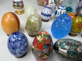many different types of glass vases on the table