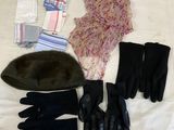 a bed with gloves, gloves, and a hat on it