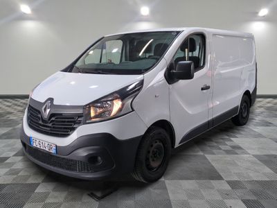 the white van is parked on a checkered tile floor