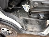 a car door open with luggage in it