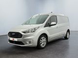 une fourgonnette Ford Transit garée dans une pièce blanche au sol noir