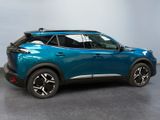 the rear end of a blue suv parked in a room
