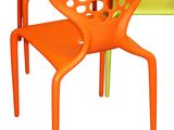orange and green plastic chairs with holes on the back of them