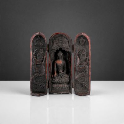 an image of a statue of a person sitting in a chair