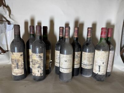 several bottles of wine are lined up in a row on a table