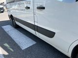 a white van that is parked in a parking lot