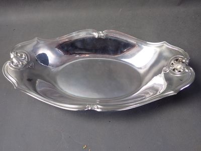a silver plate that is sitting on a table