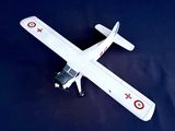 a model of a small plane on a blue surface