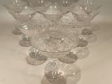 a lot of empty wine glasses sitting on a table